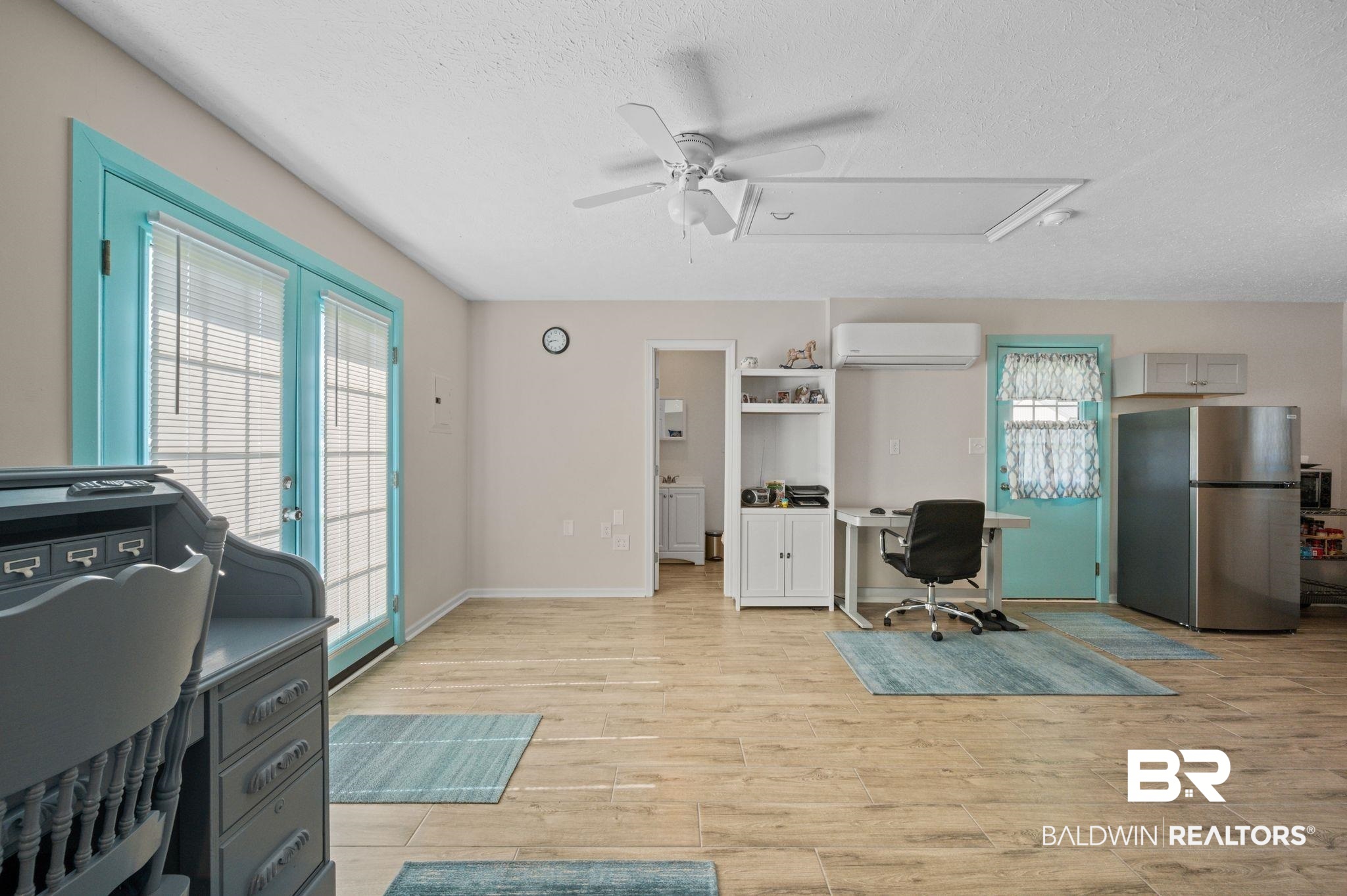 48513 Phillipsville Road Bay Minette, AL 36507 - Photo 37 of 50 Home office featuring an AC wall unit, a ceiling fan, a textured ceiling, light wood-type flooring, and attic access