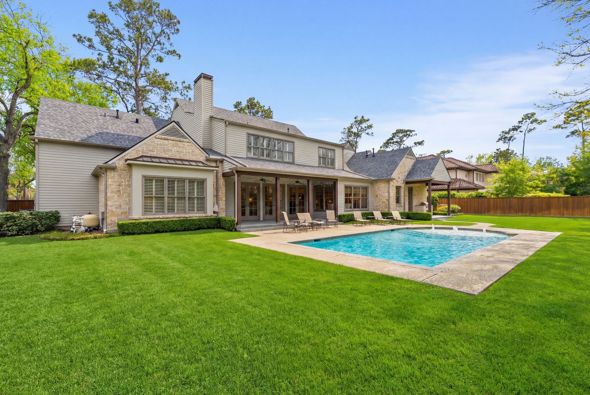 11402 Taylorcrest Road Houston, TX 77024 - Photo 5 of 44 Seamless connection between home, pool & yard creates a true backyard retreat in the heart of Hedwig Village. Timeless architecture creatures a picture perfect setting.
