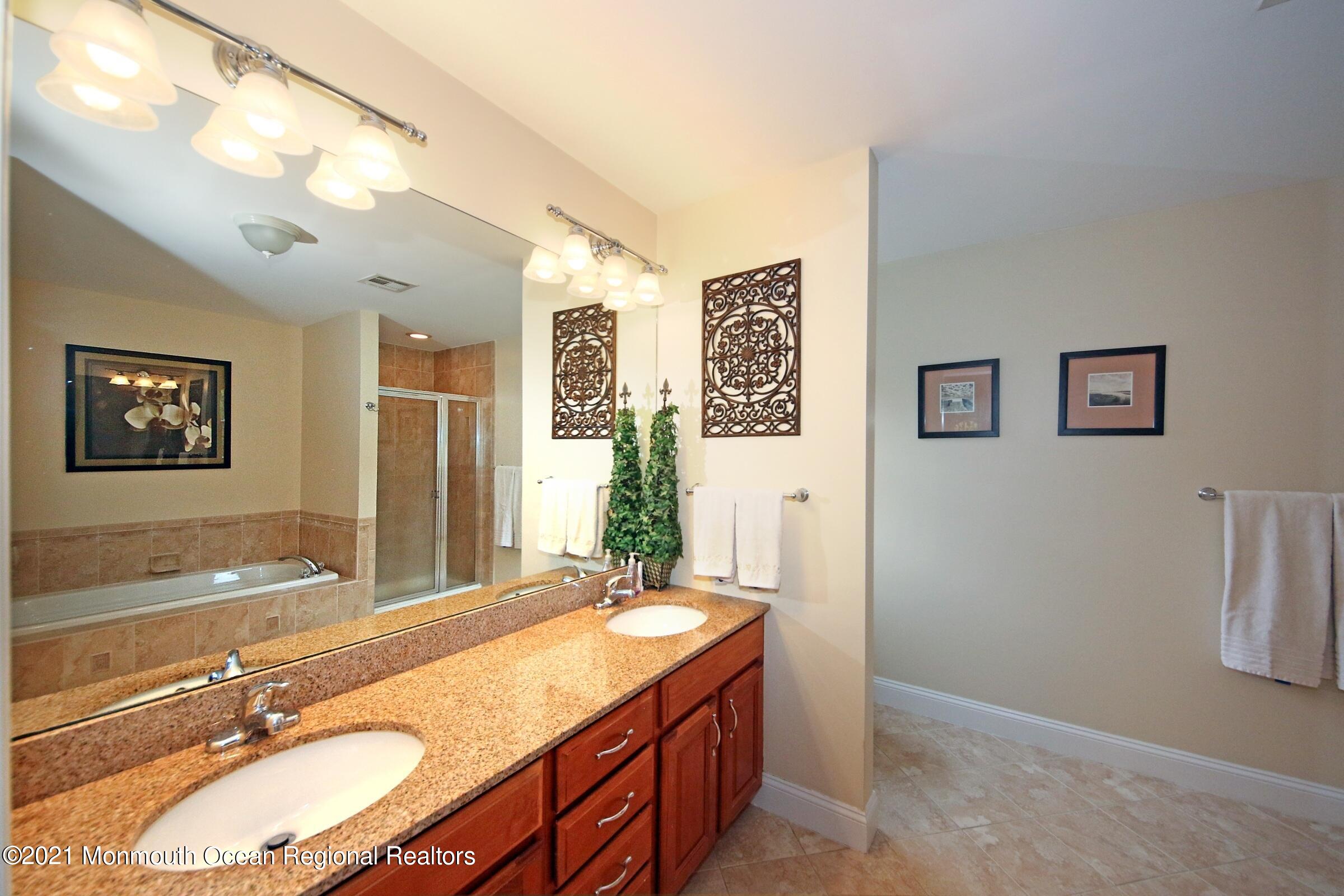 315 Florence Road Middletown, NJ 07748 - Photo 22 of 30 a bathroom with a granite countertop double vanity sink and a mirror