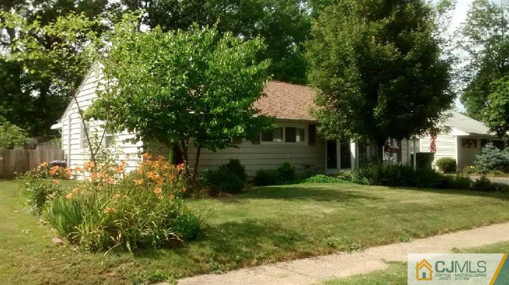 33 Idlewild Road Edison, NJ 08817 - Photo 2 of 16 a front view of a house with garden