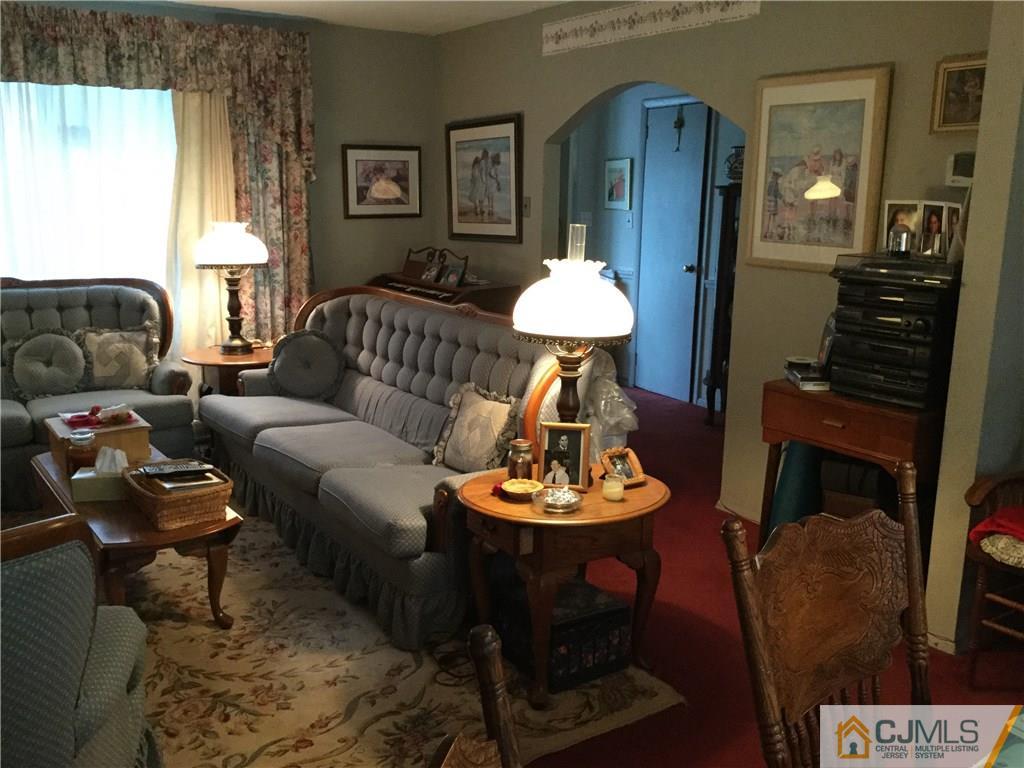 33 Idlewild Road Edison, NJ 08817 - Photo 15 of 16 a living room with furniture and a wooden floor