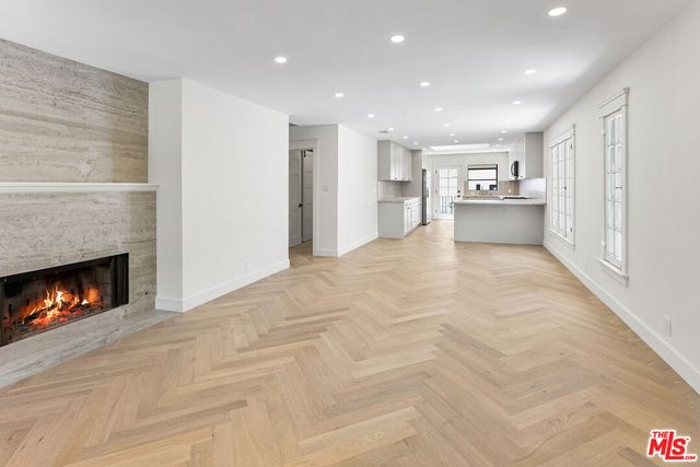 a view of an empty room with a fireplace