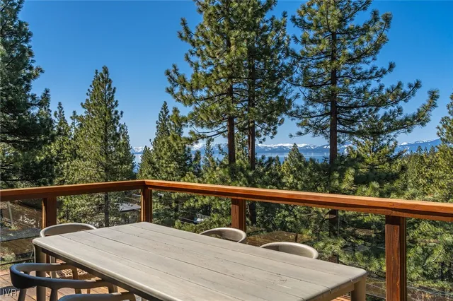 a kitchen with stainless steel appliances granite countertop a refrigerator a sink and cabinets