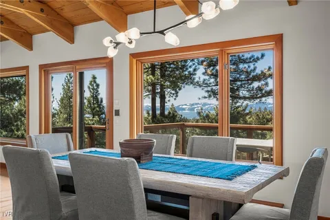 a bathroom with a tub a sink and a large mirror