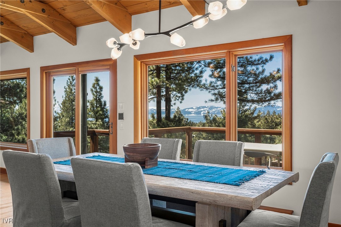 577 Eagle Drive Incline Village, NV 89451 - Photo 12 of 50 a dining room with furniture a chandelier and fireplace