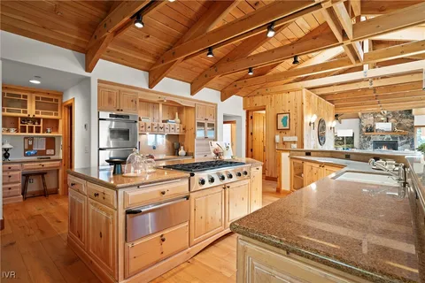 a kitchen with a sink and a refrigerator