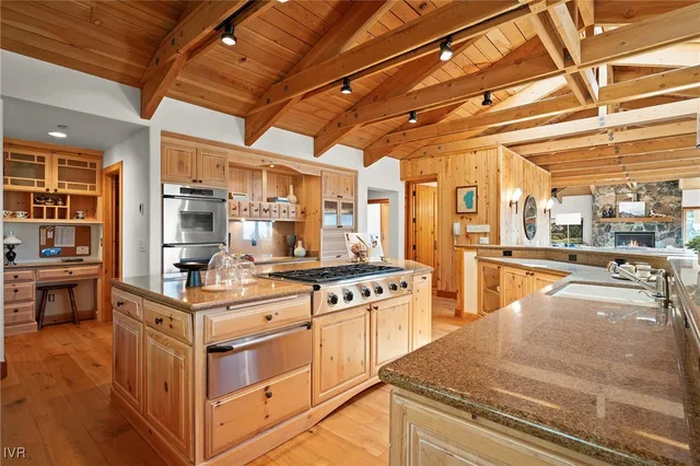 a kitchen with a sink and a refrigerator