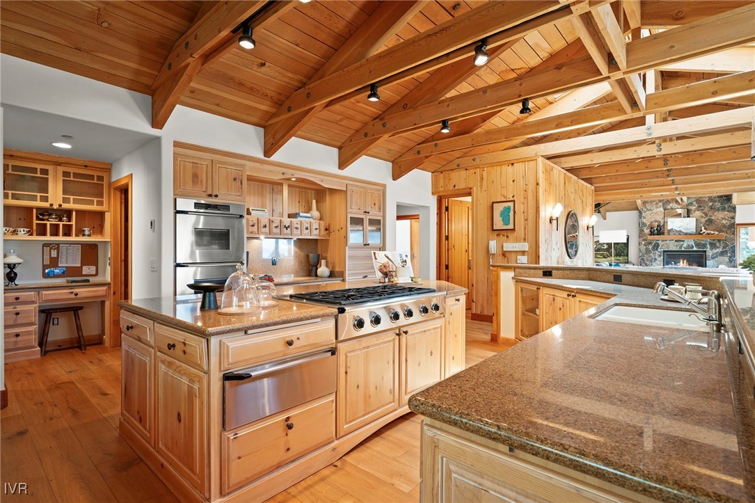 577 Eagle Drive Incline Village, NV 89451 - Photo 18 of 50 a kitchen with stainless steel appliances granite countertop a stove and cabinets