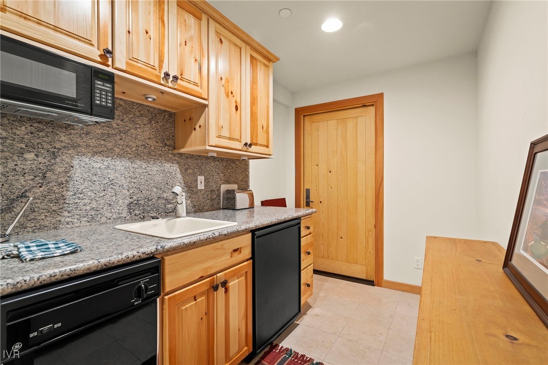 577 Eagle Drive Incline Village, NV 89451 - Photo 41 of 50 a kitchen with a sink and a refrigerator