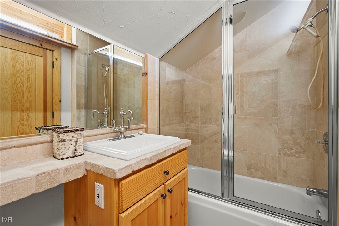 577 Eagle Drive Incline Village, NV 89451 - Photo 44 of 50 a bathroom with a granite countertop sink and a mirror