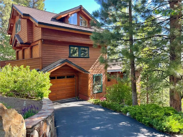 a dining room with furniture a chandelier and fireplace