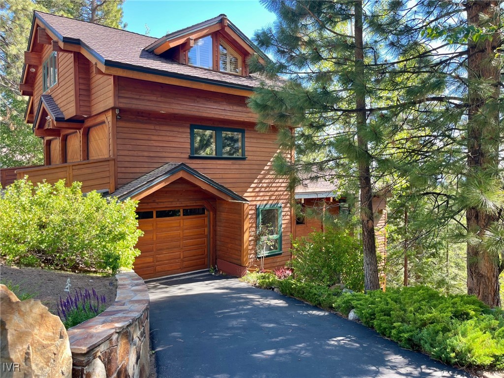577 Eagle Drive Incline Village, NV 89451 - Photo 5 of 50 a front view of a house with a garden