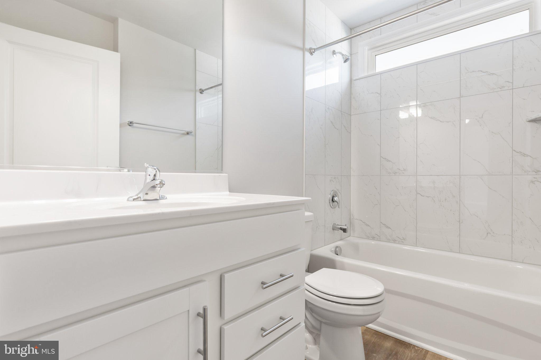 10 Azalea Way Colonial Beach, VA 22443 - Photo 15 of 36 a bathroom with a sink a toilet and a bathtub