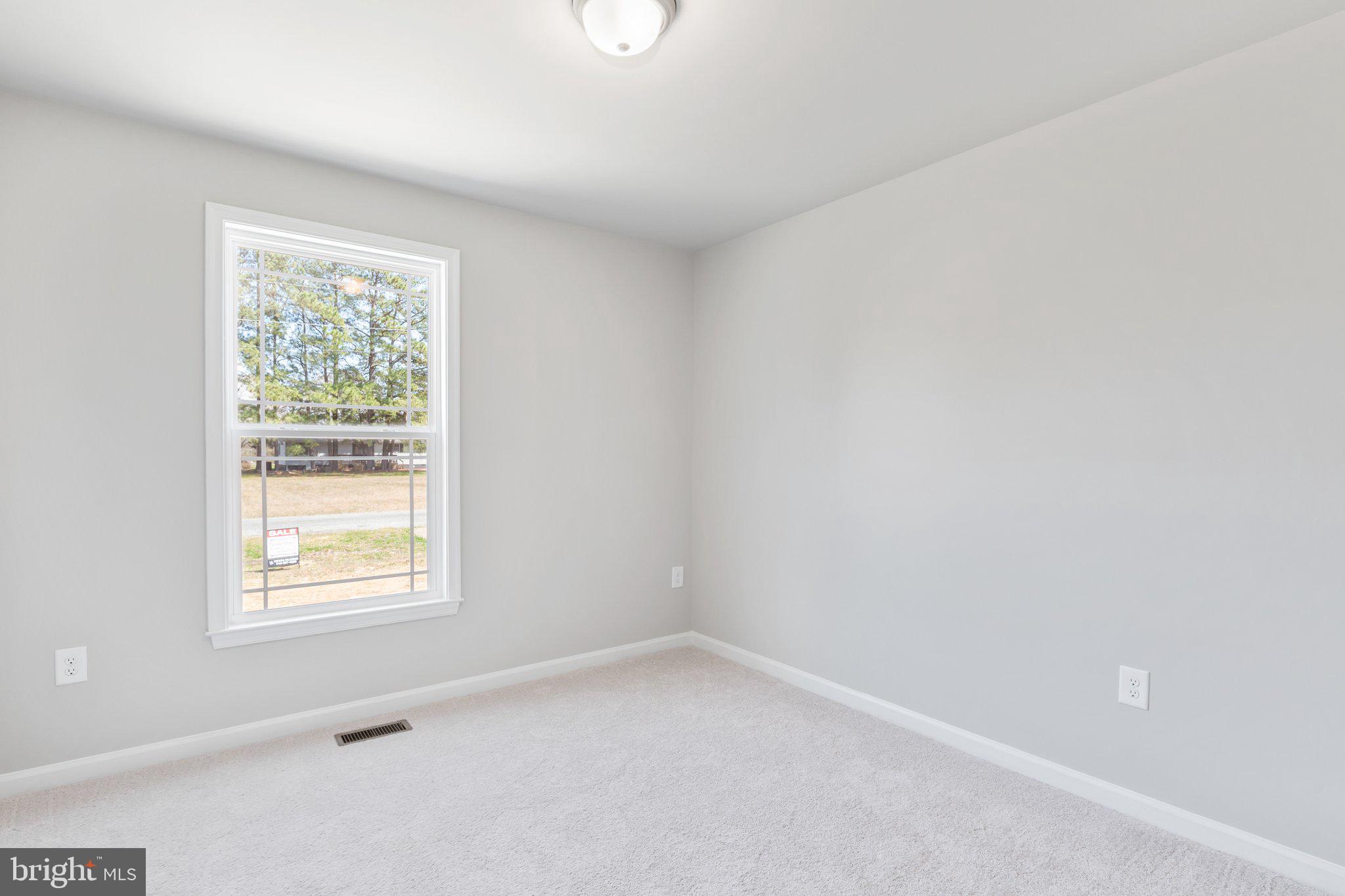 10 Azalea Way Colonial Beach, VA 22443 - Photo 18 of 36 an empty room with a window