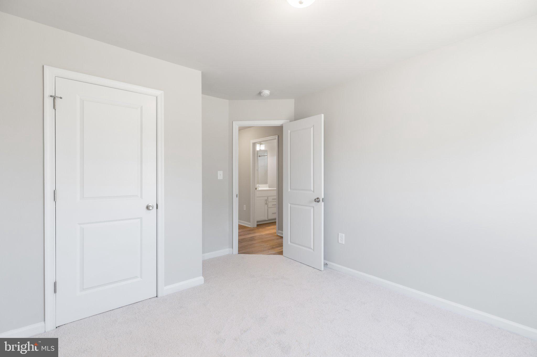 10 Azalea Way Colonial Beach, VA 22443 - Photo 19 of 36 a view of an empty room and closet area