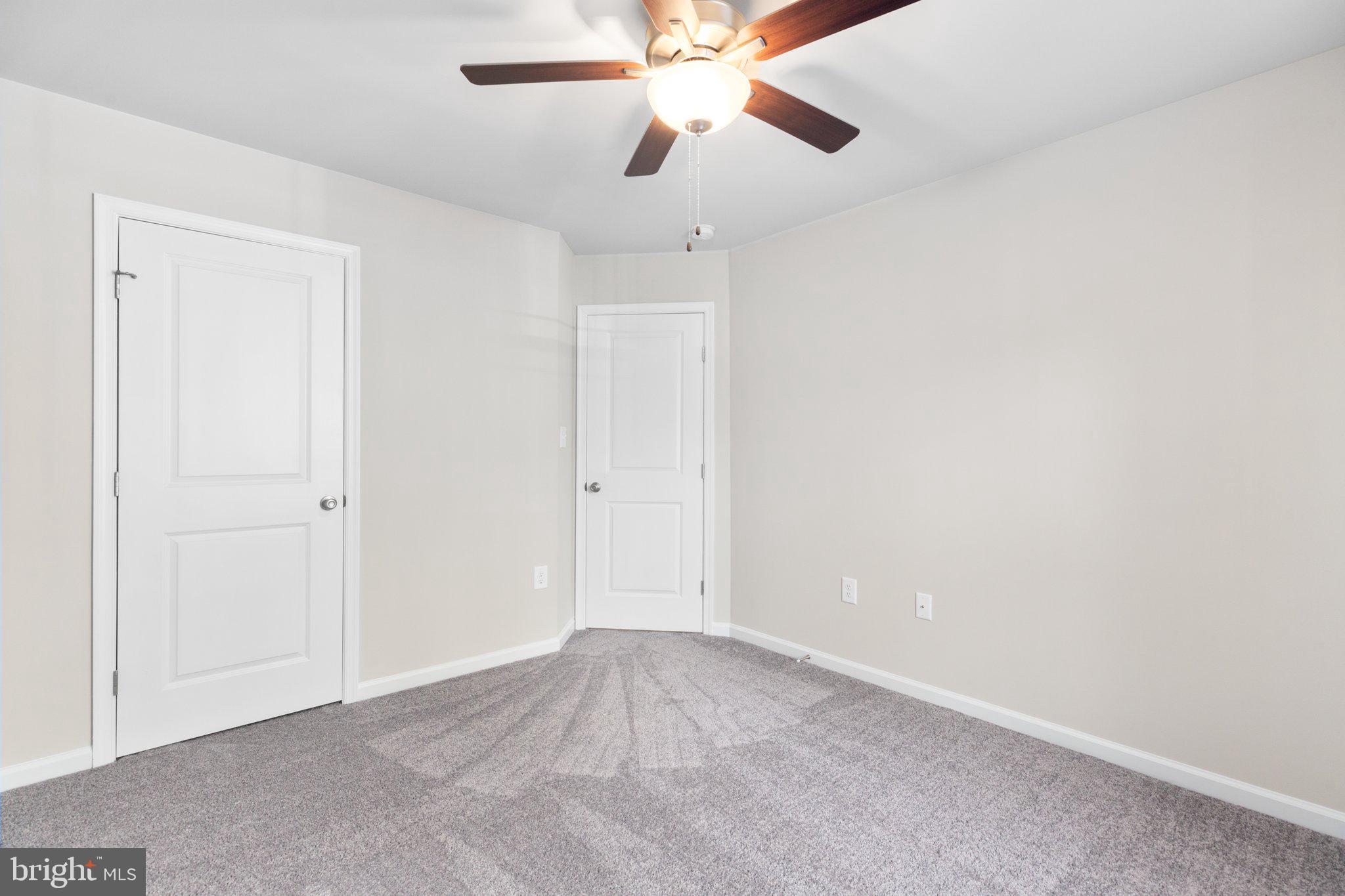 10 Azalea Way Colonial Beach, VA 22443 - Photo 22 of 36 an empty room with chandelier fan