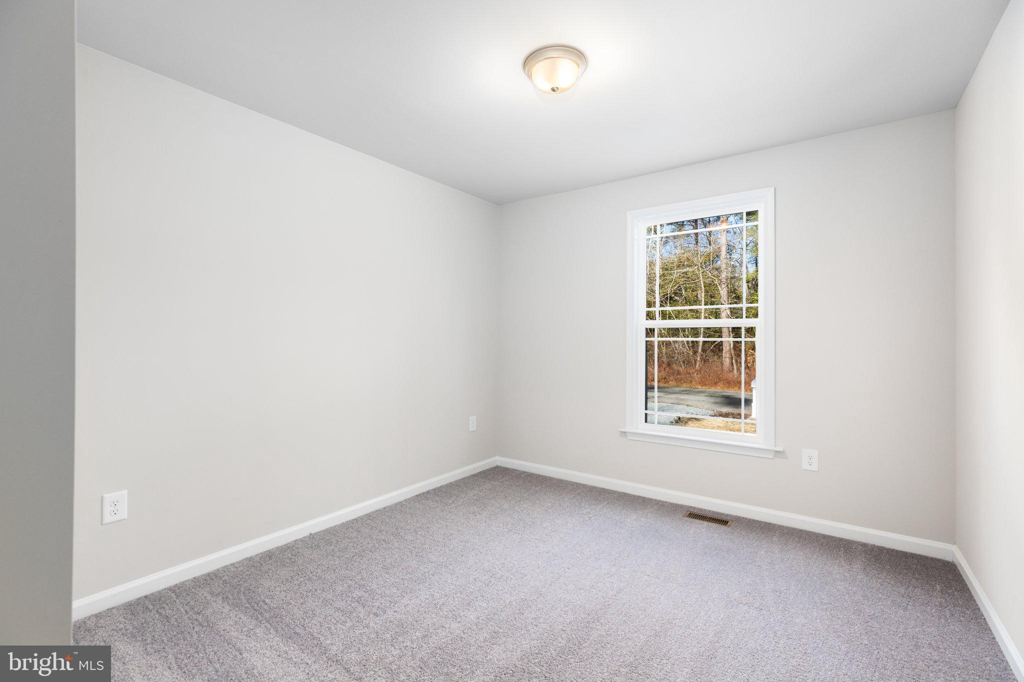 10 Azalea Way Colonial Beach, VA 22443 - Photo 23 of 36 an empty room with a window