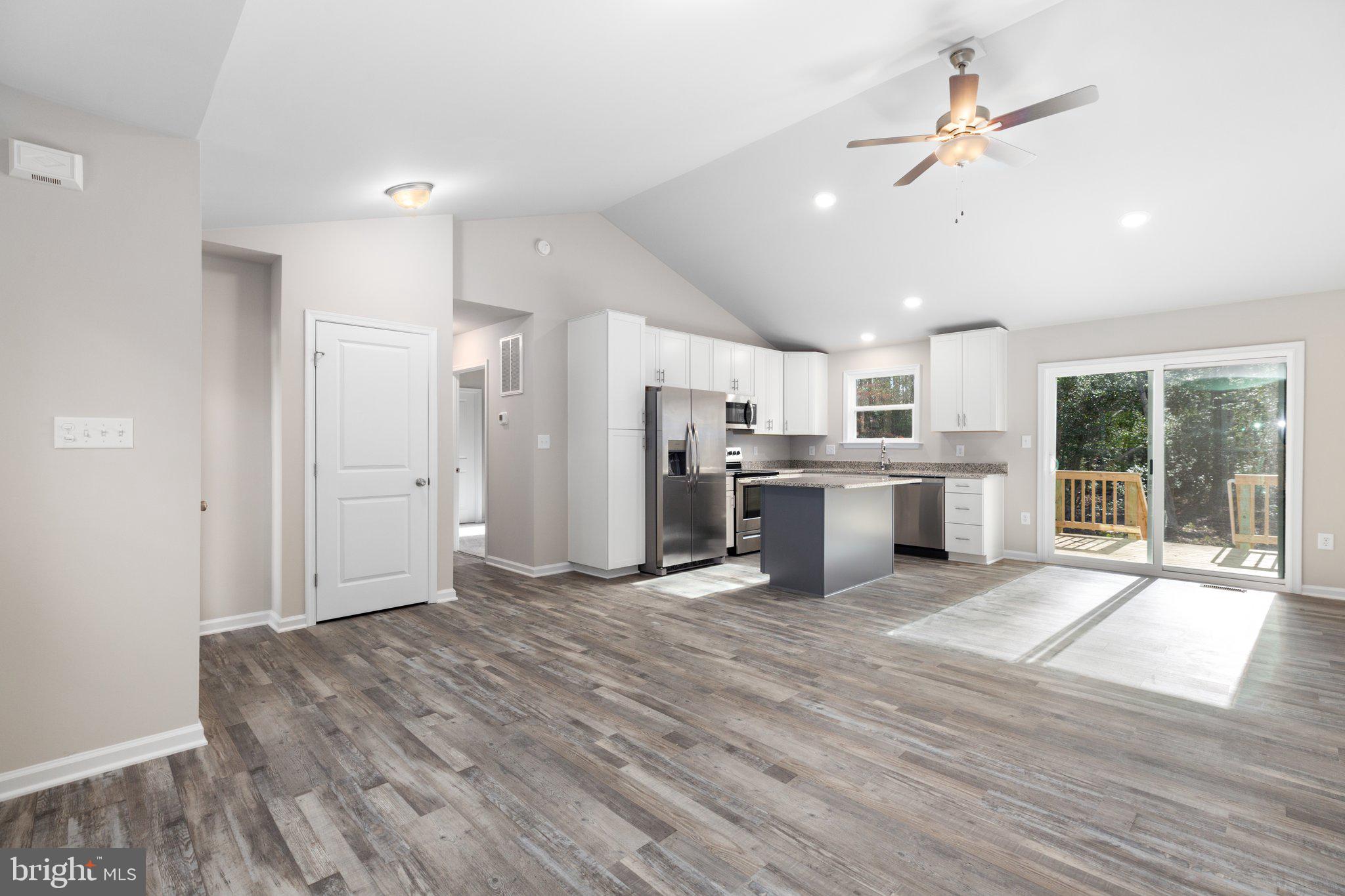 10 Azalea Way Colonial Beach, VA 22443 - Photo 29 of 36 a view of a kitchen with a stove cabinets and wooden floor