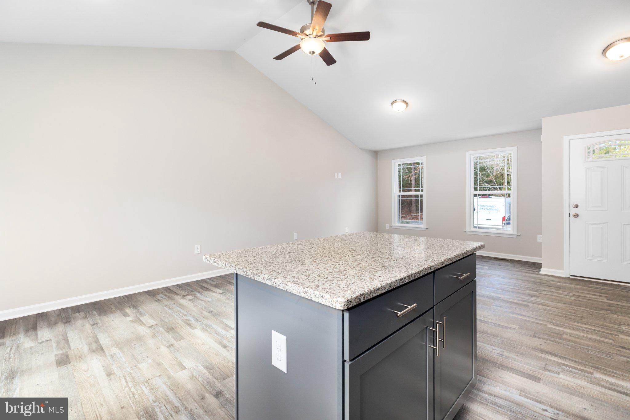 10 Azalea Way Colonial Beach, VA 22443 - Photo 34 of 36 a kitchen with a wooden floor and a window