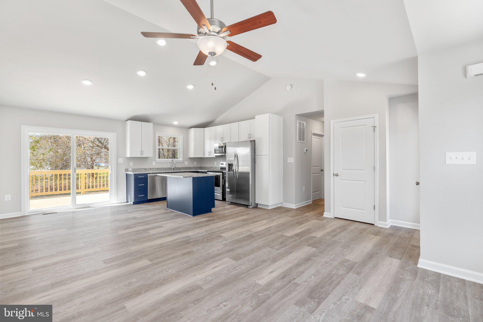 10 Azalea Way Colonial Beach, VA 22443 - Photo 5 of 36 a view of a kitchen with a stove cabinets and wooden floor