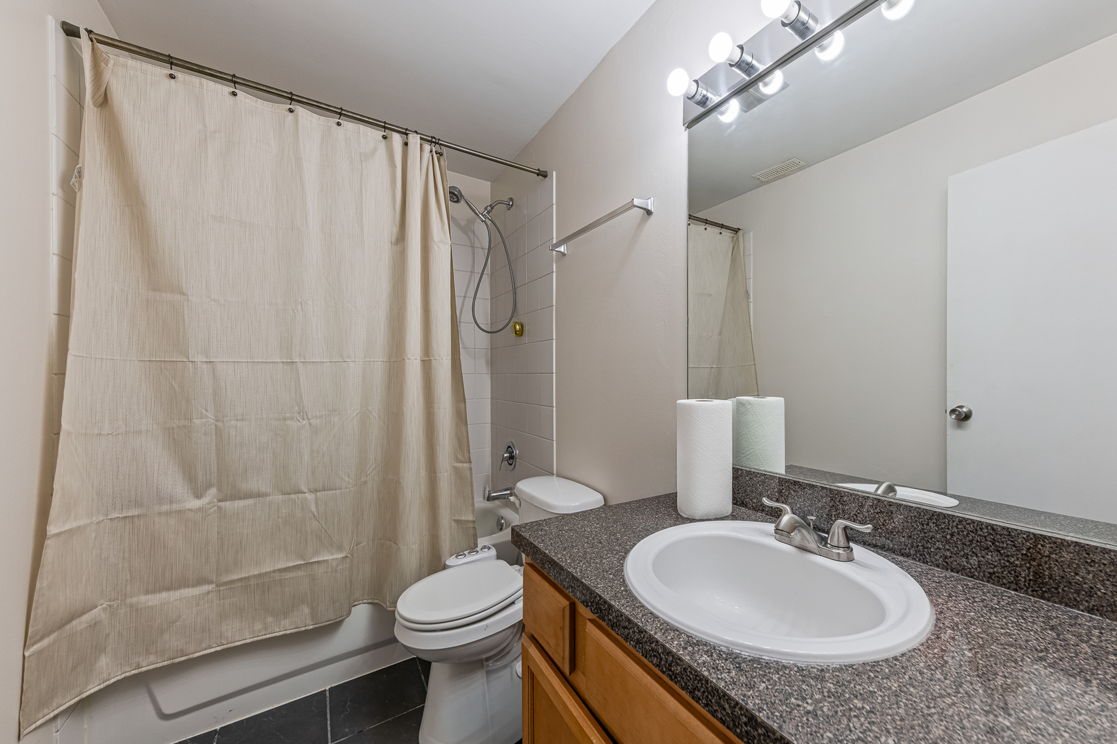 6015 Forest View Road, Unit 2A Lisle, IL 60532 - Photo 11 of 12 a bathroom with a sink toilet and shower