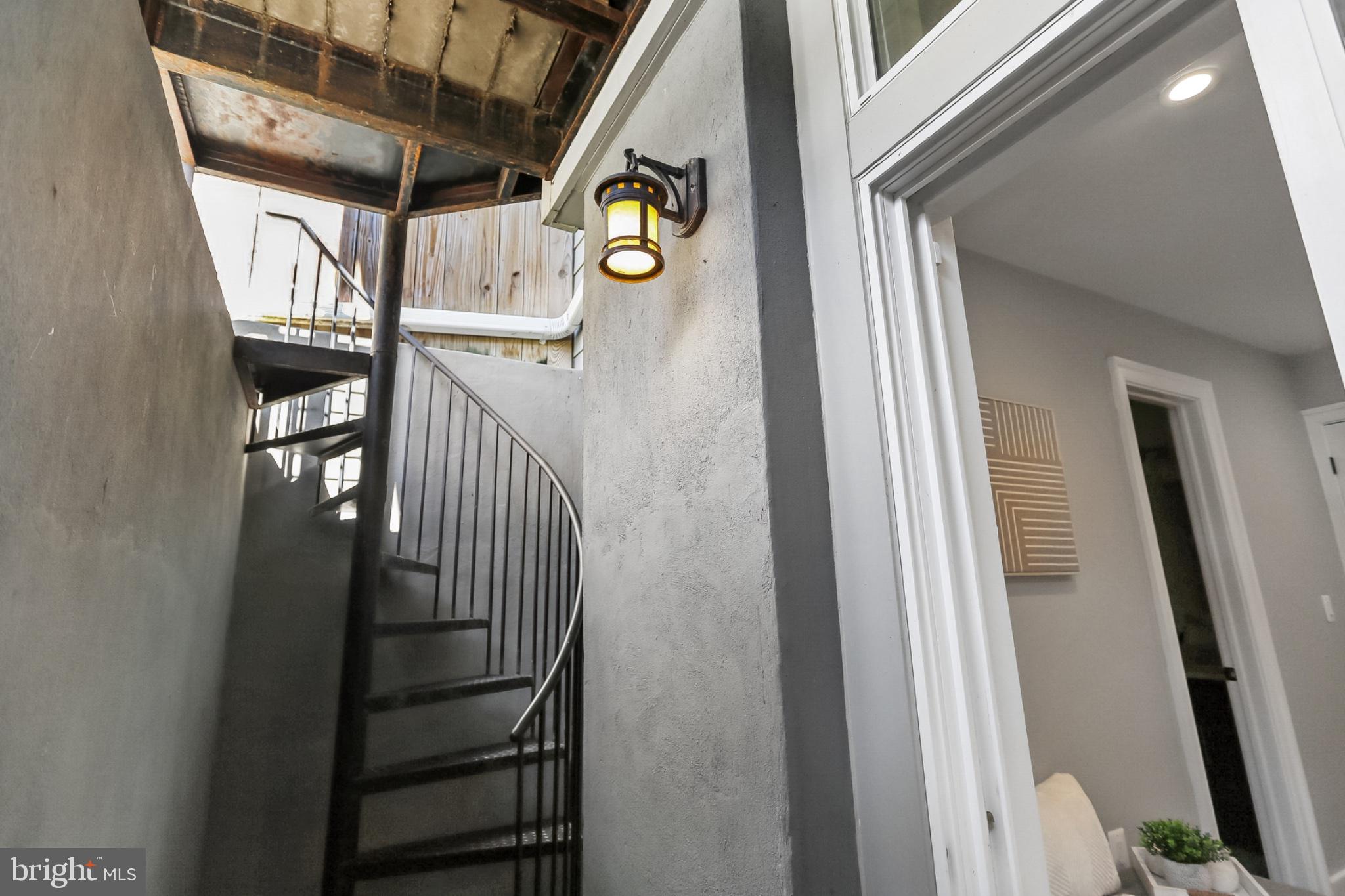 1311 K Street Southeast, Unit 1 Washington, DC 20003 - Photo 24 of 33 Spiral staircase to shared back yard area.