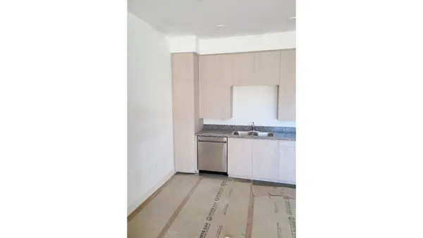 a kitchen with a sink and a stove