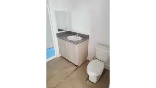 a bathroom with a sink and toilet