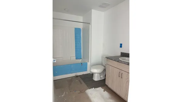 a bathroom with a toilet a sink and a bathtub