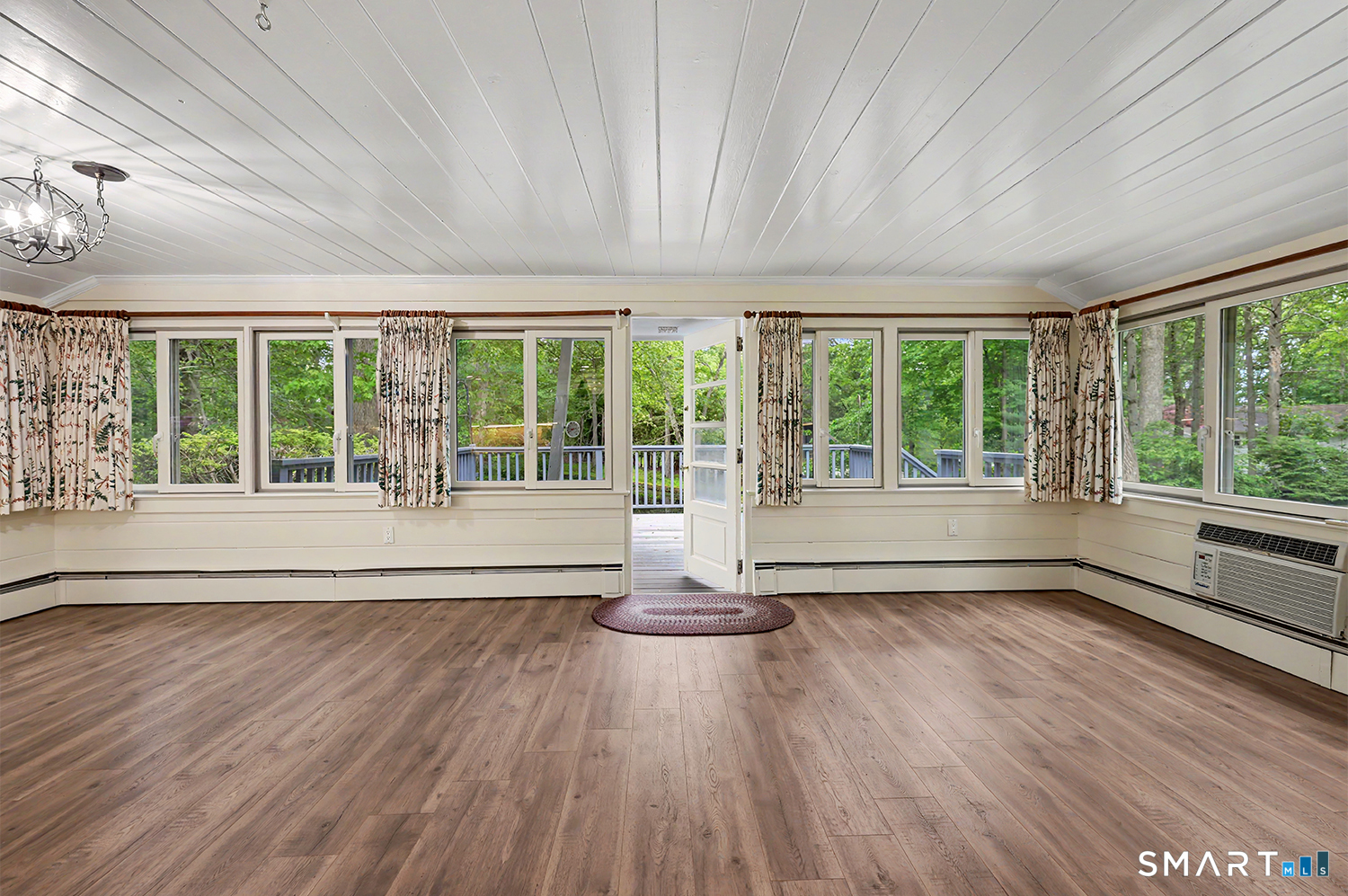 19 Geneva Road Norwalk, CT 06850 - Photo 16 of 33 a view of an empty room with wooden floor and a window