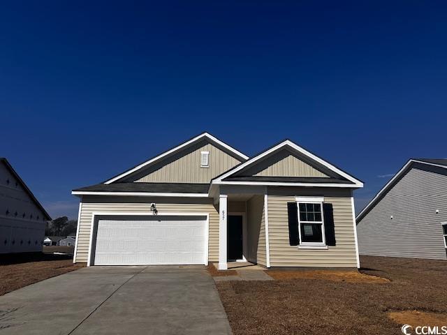 657 Castillo Drive Loris, SC 29569 - Photo 1 of 14 View of front of home with concrete driveway and a