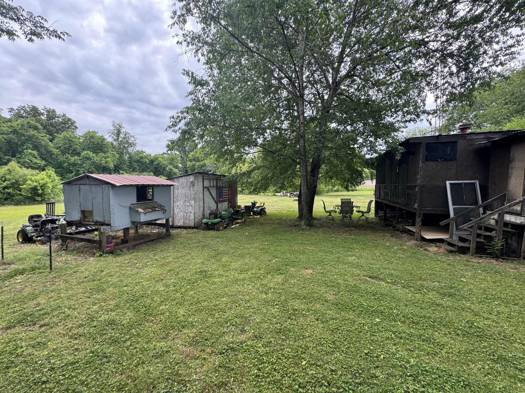 102 Sugar Tree Road Pulaski, TN 38478 - Photo 12 of 35 a view of a backyard with furniture and a fire pit