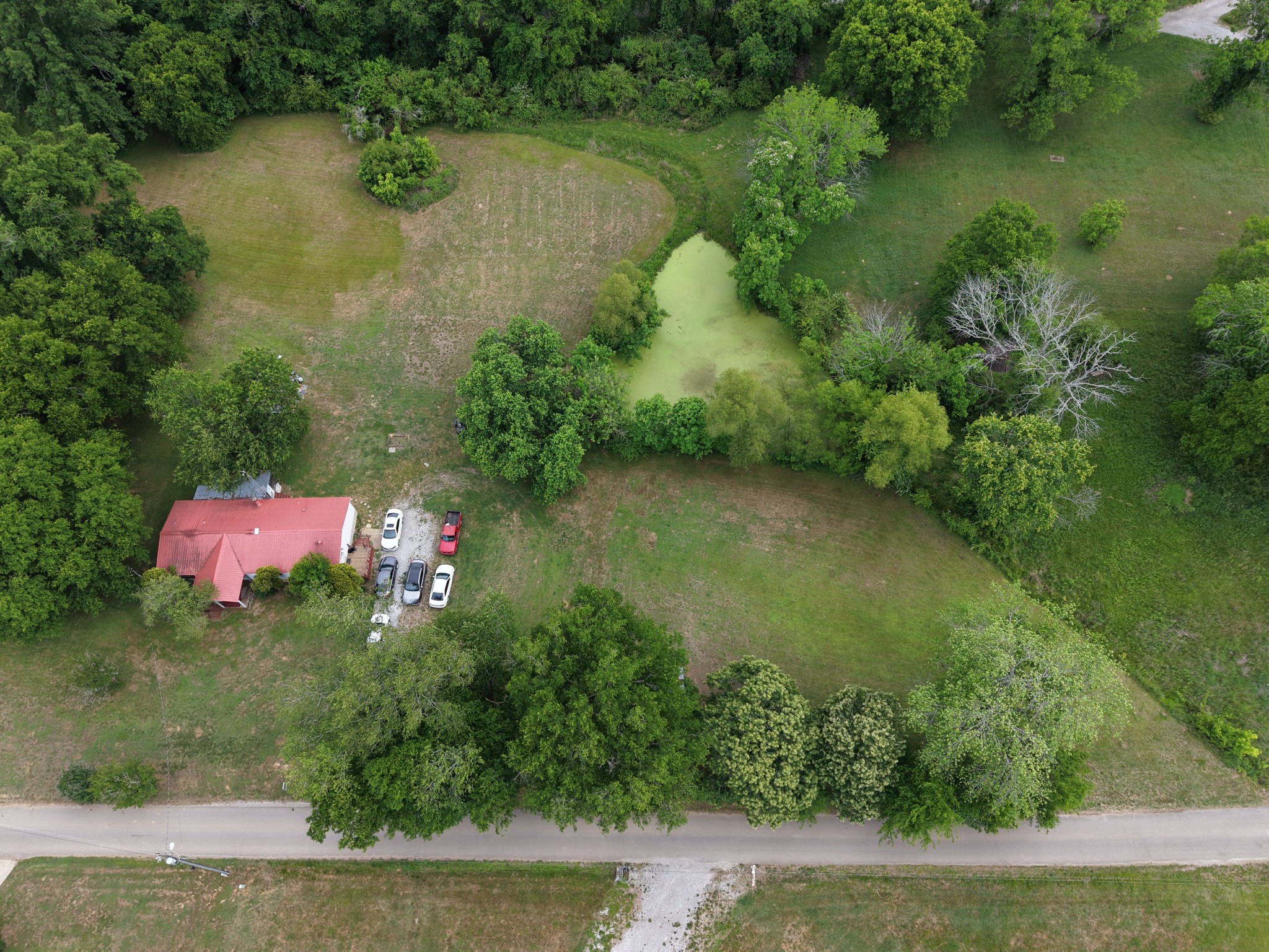 102 Sugar Tree Road Pulaski, TN 38478 - Photo 3 of 35 an aerial view of a house with a yard and lake view