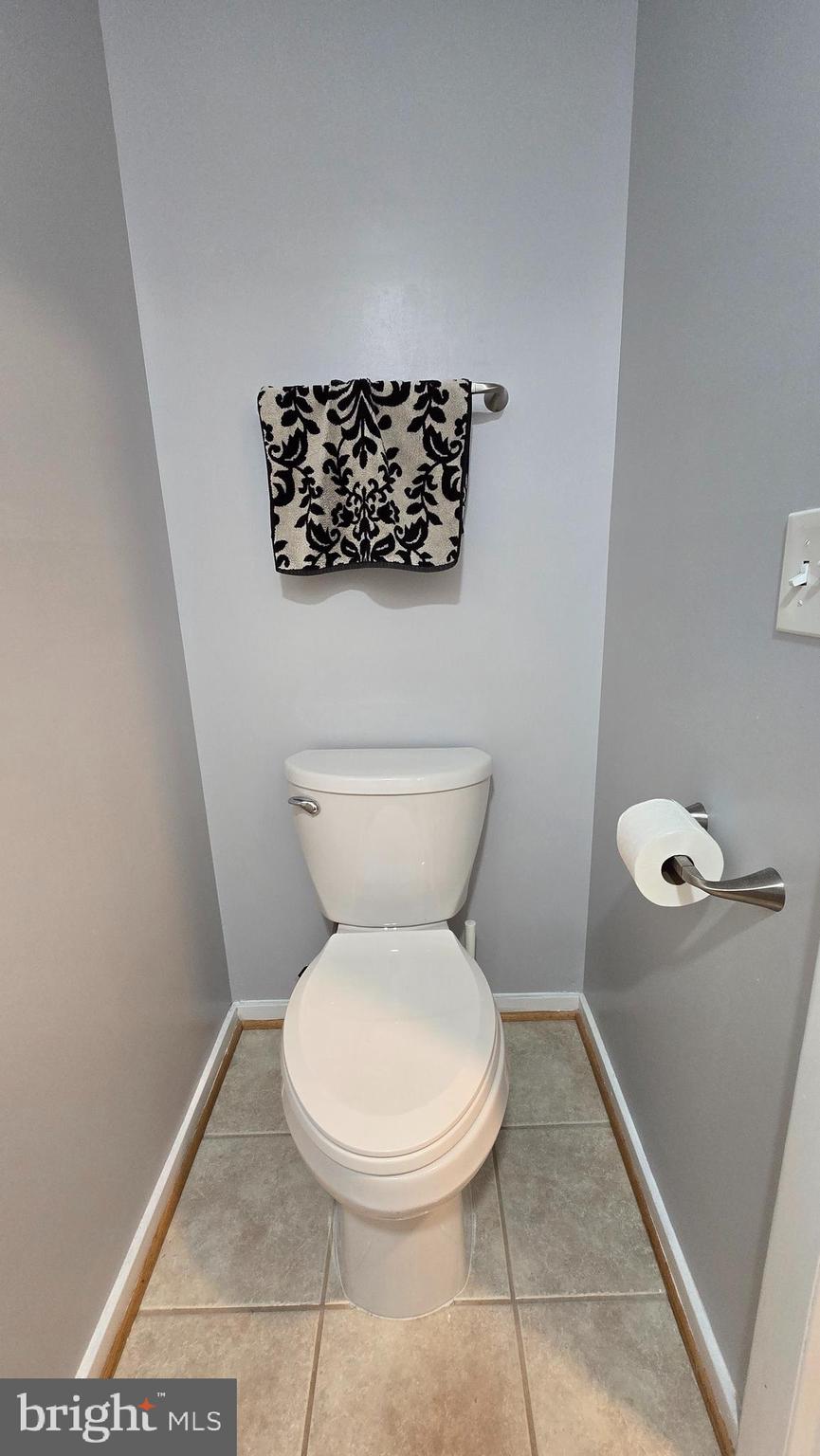 5987 Clerkenwell Court Burke, VA 22015 - Photo 14 of 41 a white toilet sitting next to a white wall
