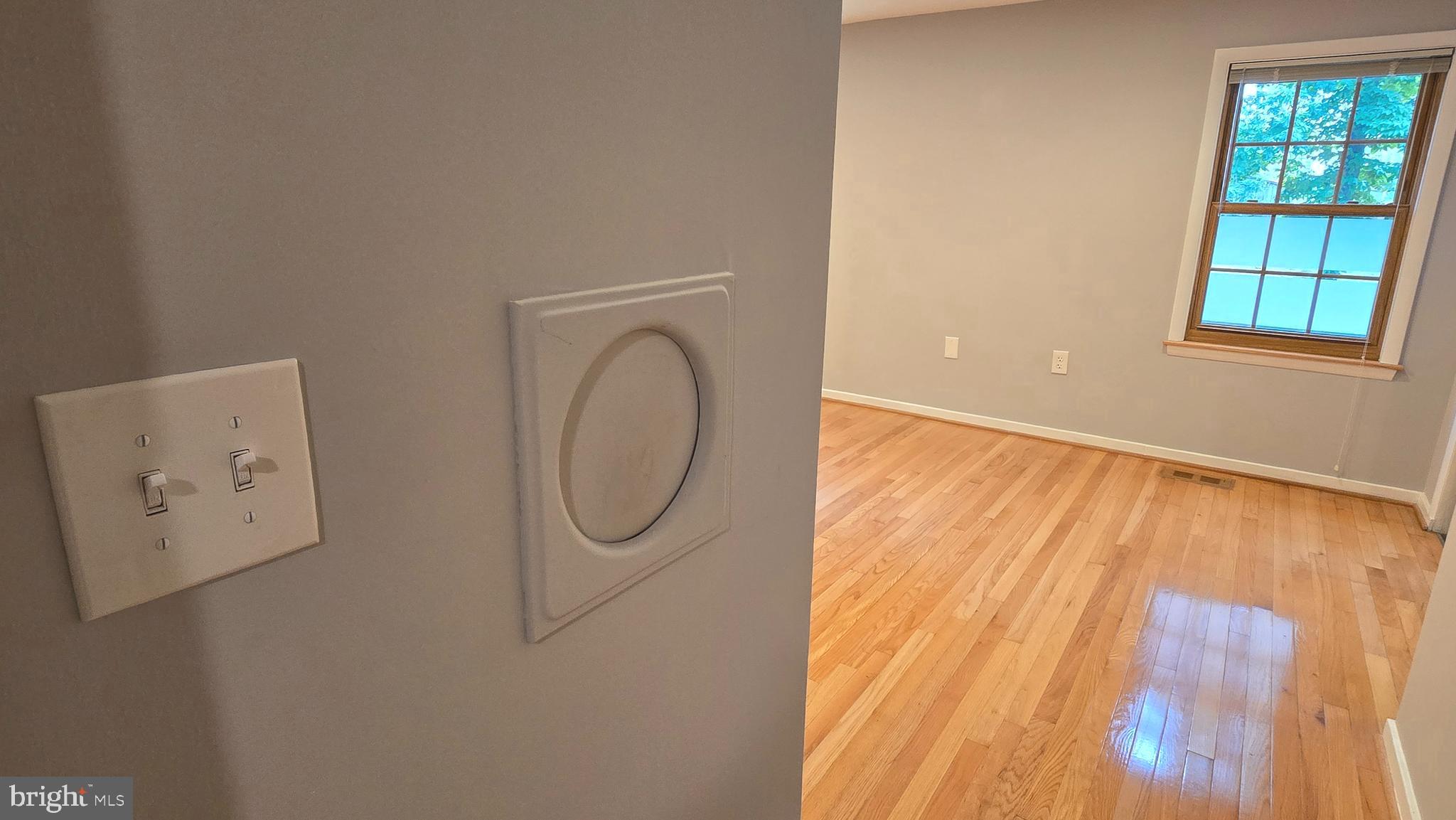5987 Clerkenwell Court Burke, VA 22015 - Photo 19 of 41 a view of a room with wooden floor and windows
