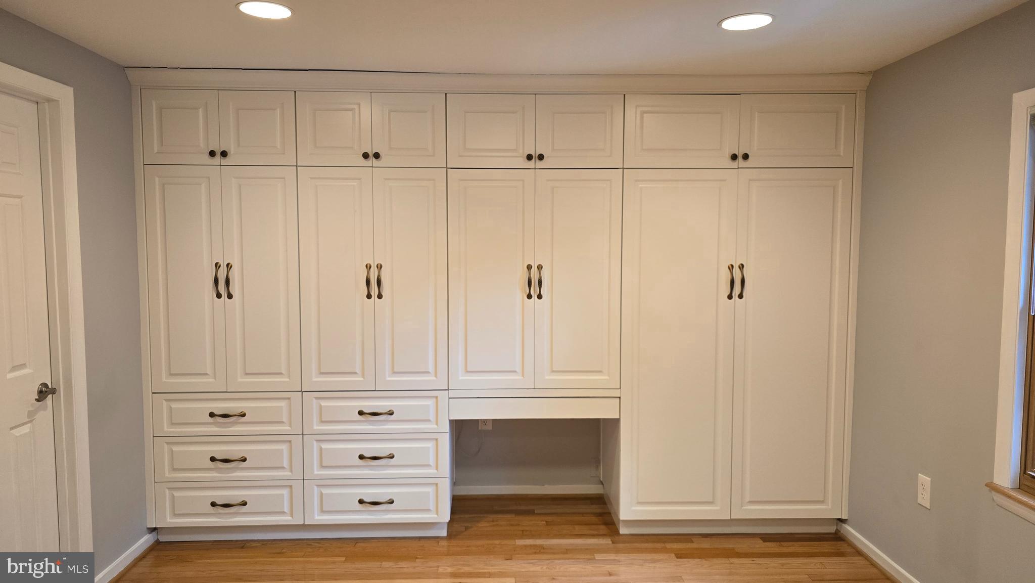 5987 Clerkenwell Court Burke, VA 22015 - Photo 23 of 41 a view of an empty room with wooden floor