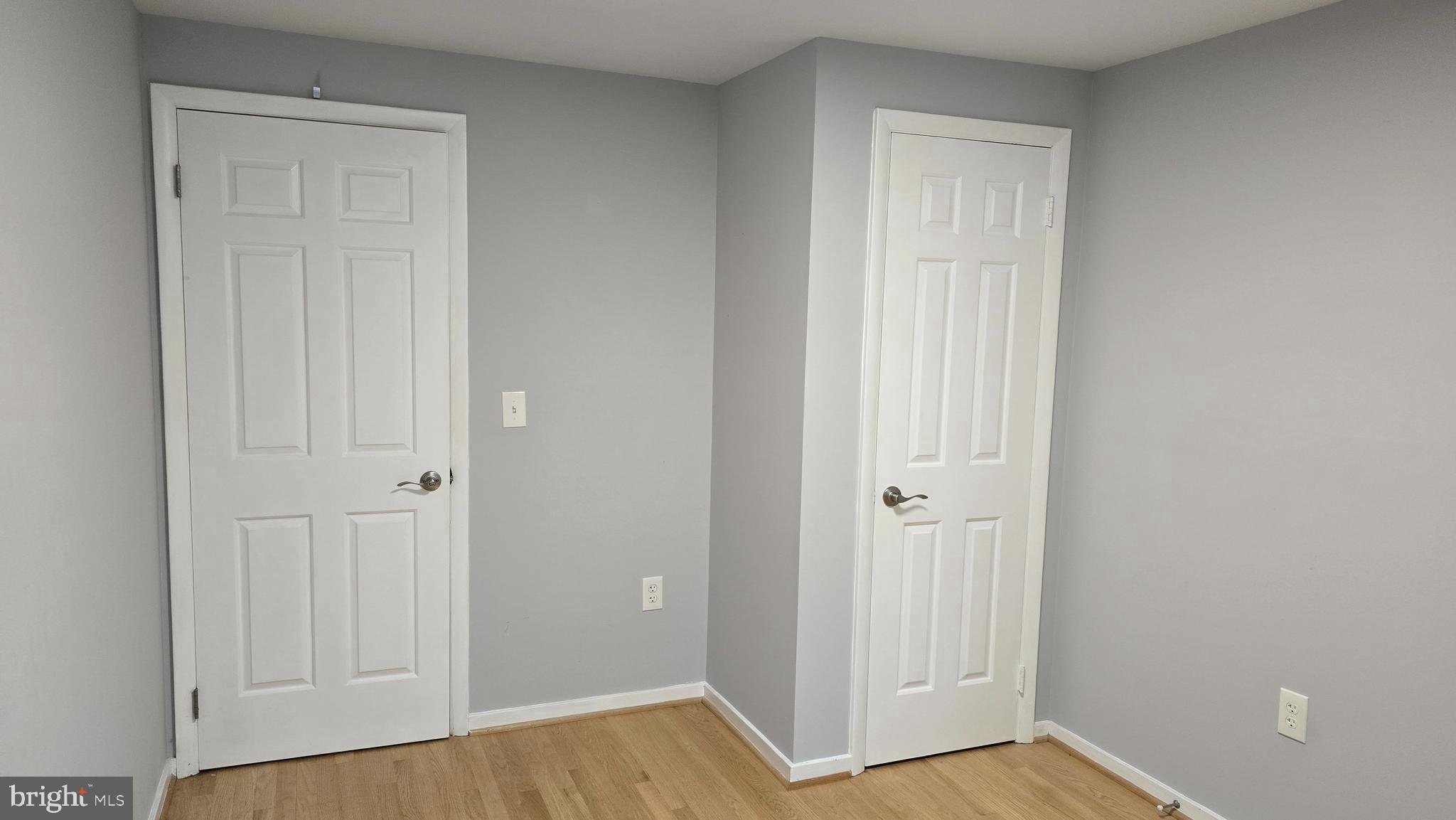 5987 Clerkenwell Court Burke, VA 22015 - Photo 27 of 41 a view of a hallway with wooden floor