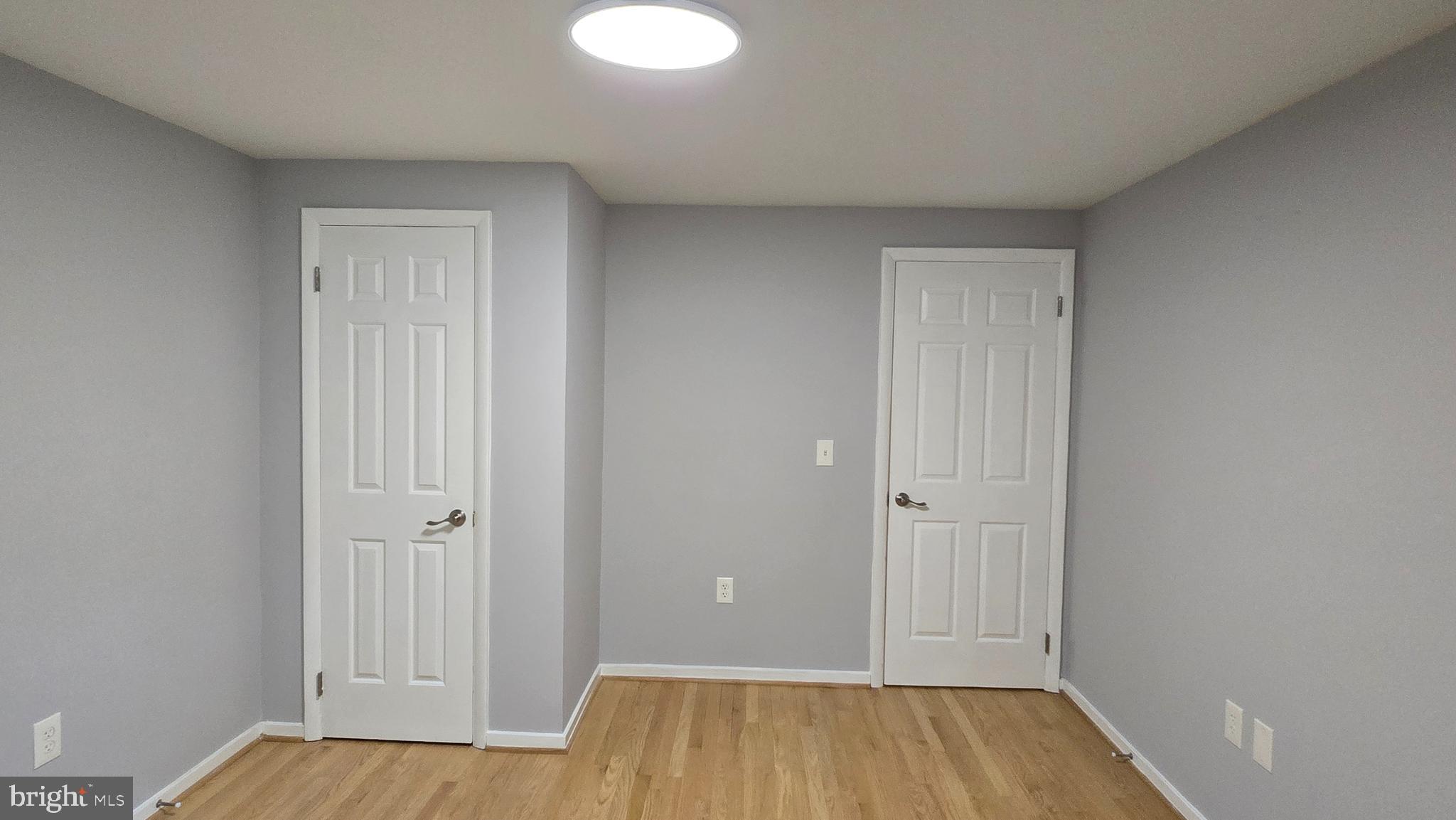 5987 Clerkenwell Court Burke, VA 22015 - Photo 29 of 41 a view of a room with wooden floor