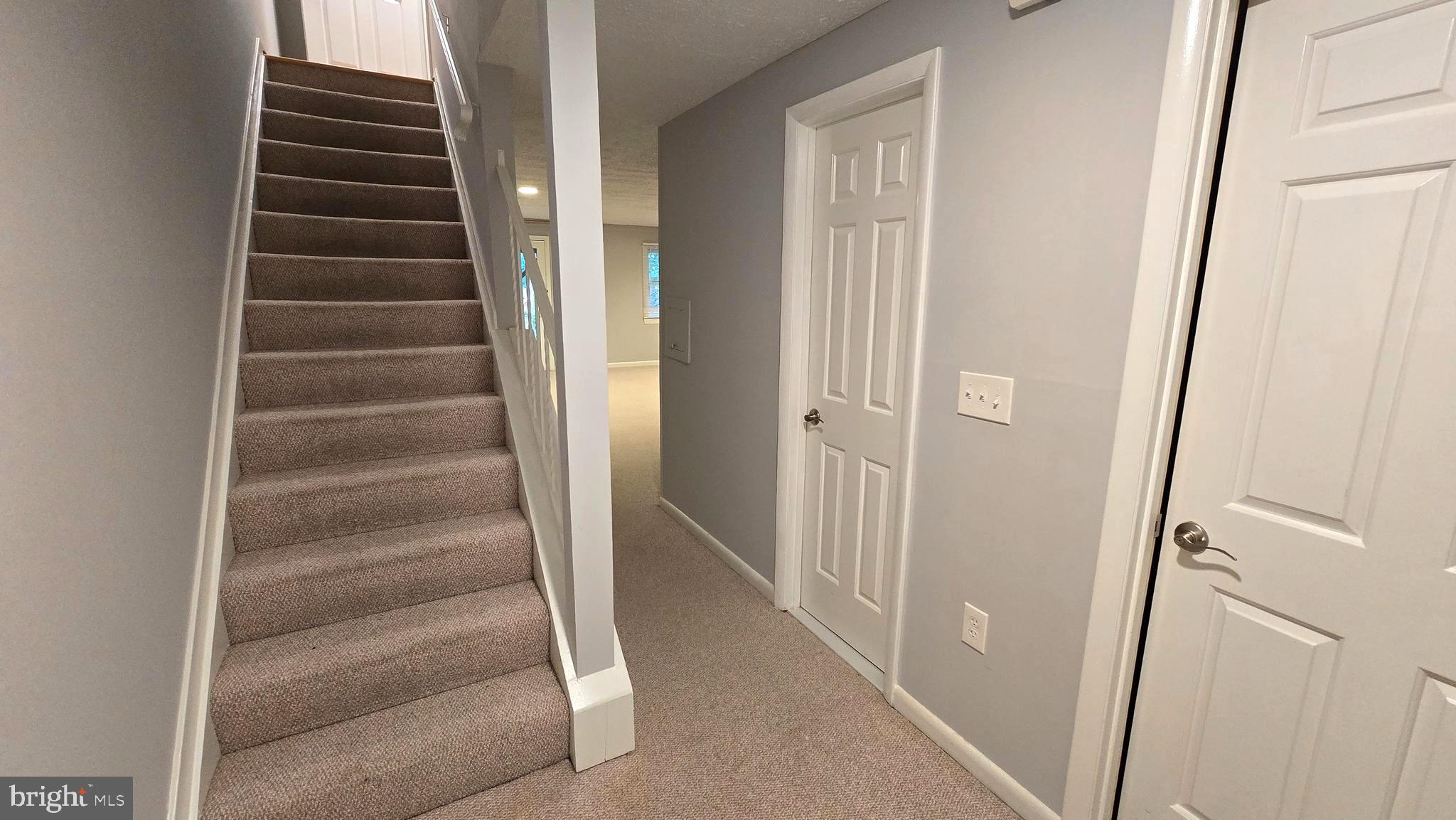 5987 Clerkenwell Court Burke, VA 22015 - Photo 30 of 41 a view of an entryway with stairs