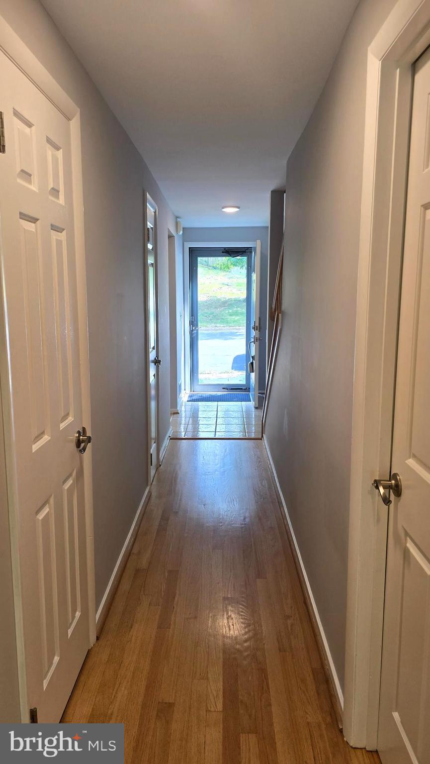 5987 Clerkenwell Court Burke, VA 22015 - Photo 3 of 41 a view of gallery with wooden floor