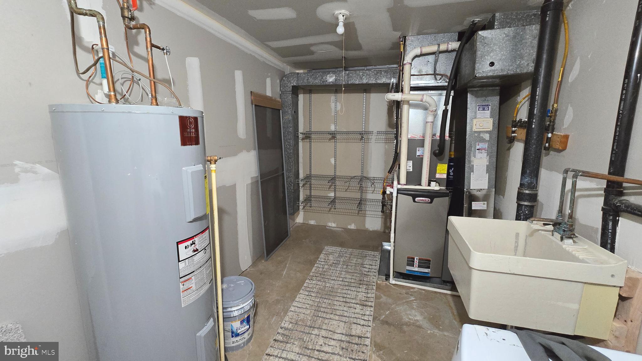 5987 Clerkenwell Court Burke, VA 22015 - Photo 38 of 41 a bathroom with a bathtub a toilet and a shower