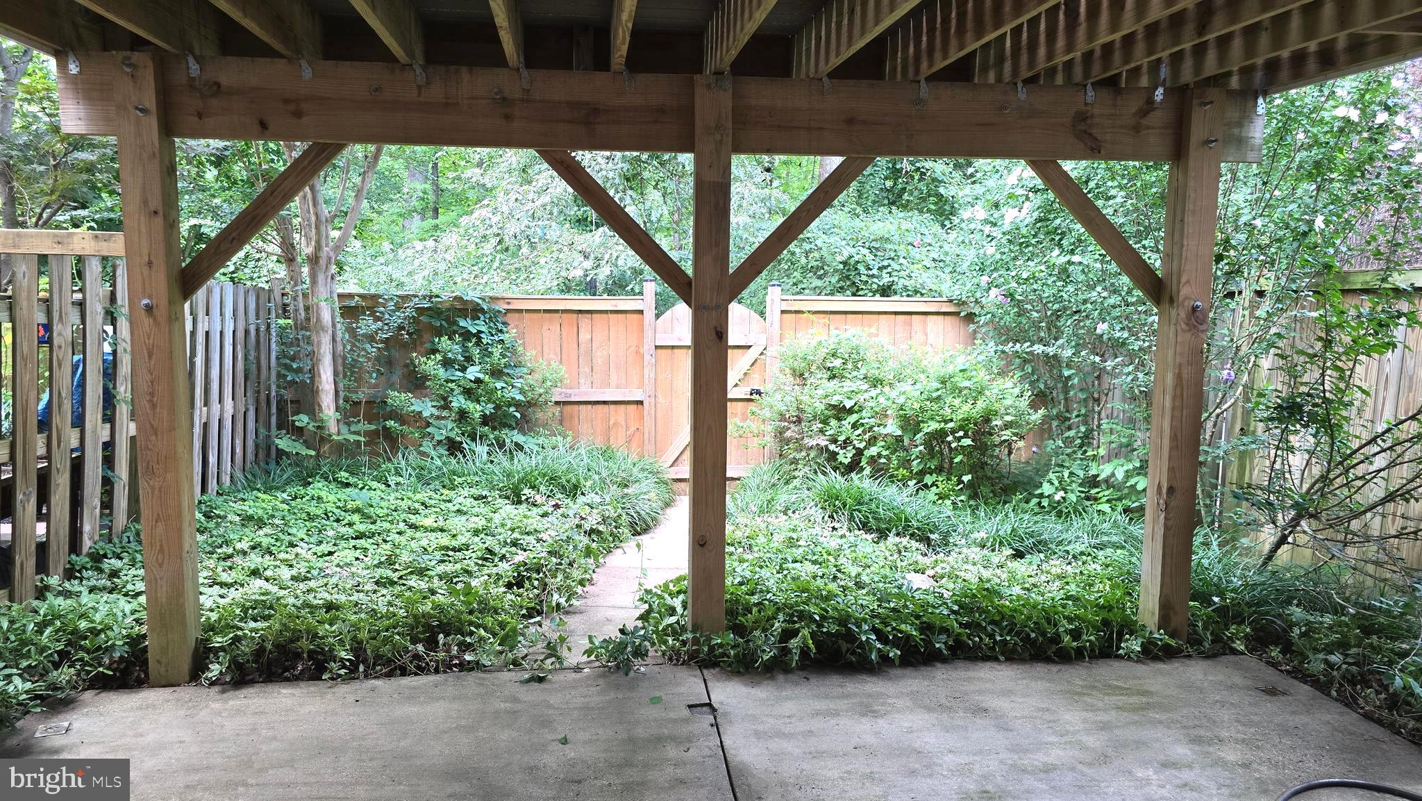 5987 Clerkenwell Court Burke, VA 22015 - Photo 40 of 41 a view of a backyard with garden