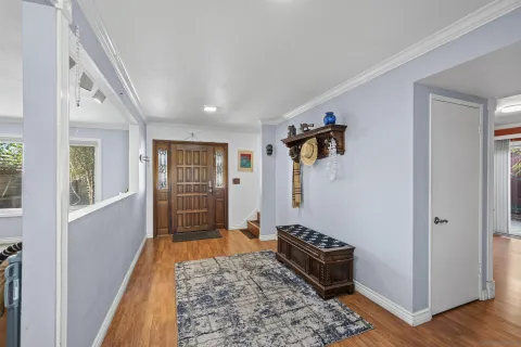 a kitchen with a stove a sink and a refrigerator