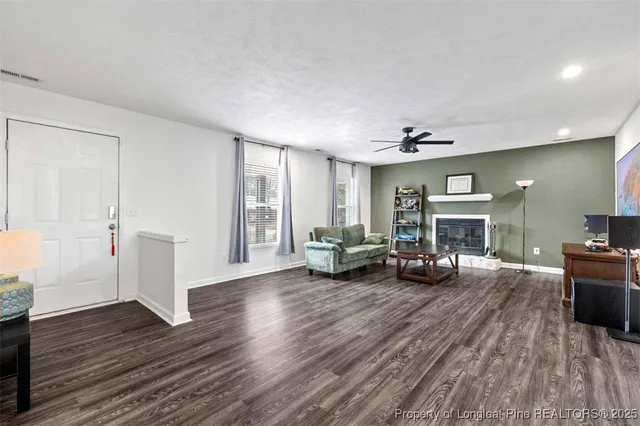 a view of a livingroom with furniture and a fireplace