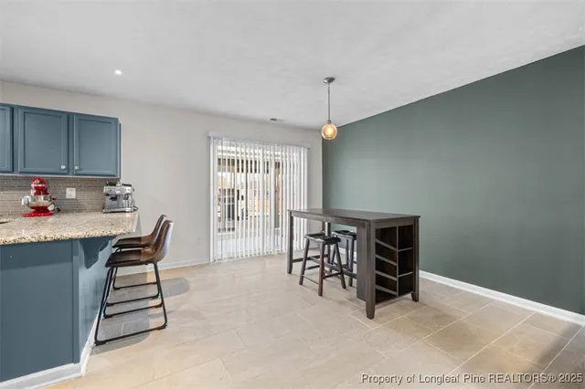 an empty room with furniture and windows