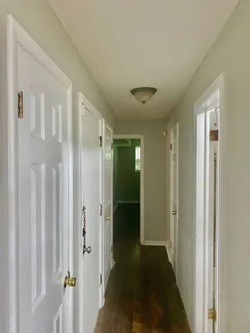 a view of a bathroom from the hallway