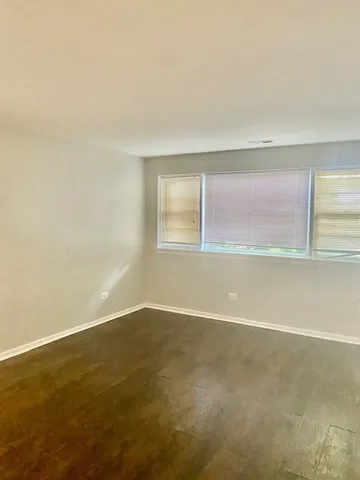 an empty room with a empty space and window
