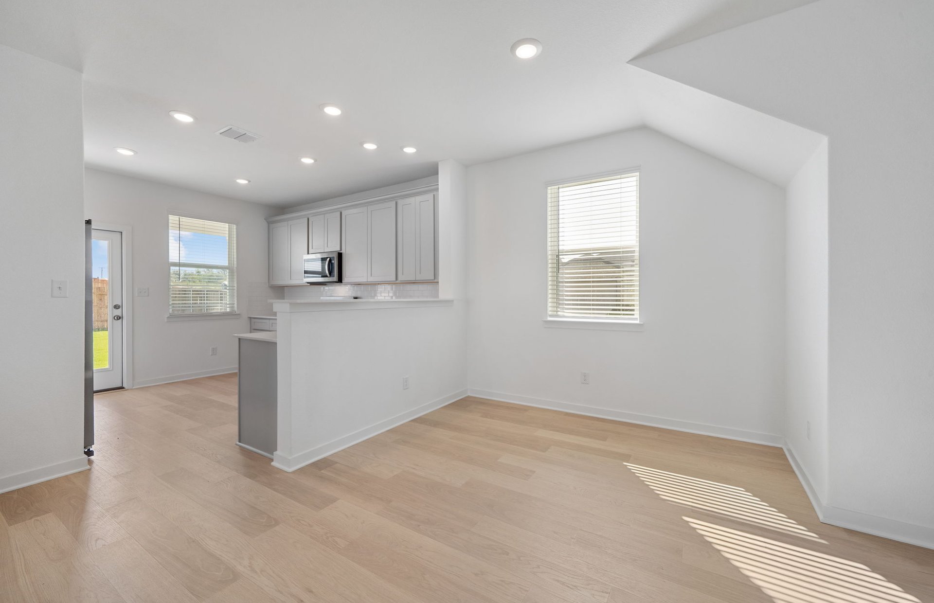 608 Rubber Tree Way Buda, TX 78610 - Photo 6 of 29 a view of a kitchen with a sink and refrigerator