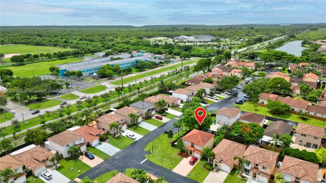 an aerial view of residential houses with outdoor space