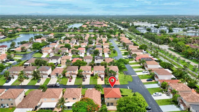 an aerial view of residential houses with outdoor space